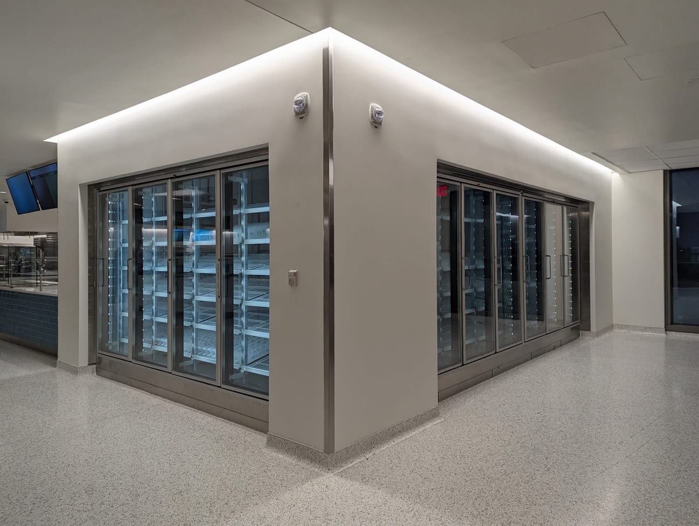 Glass-door walk-in cooler installed in a commercial building