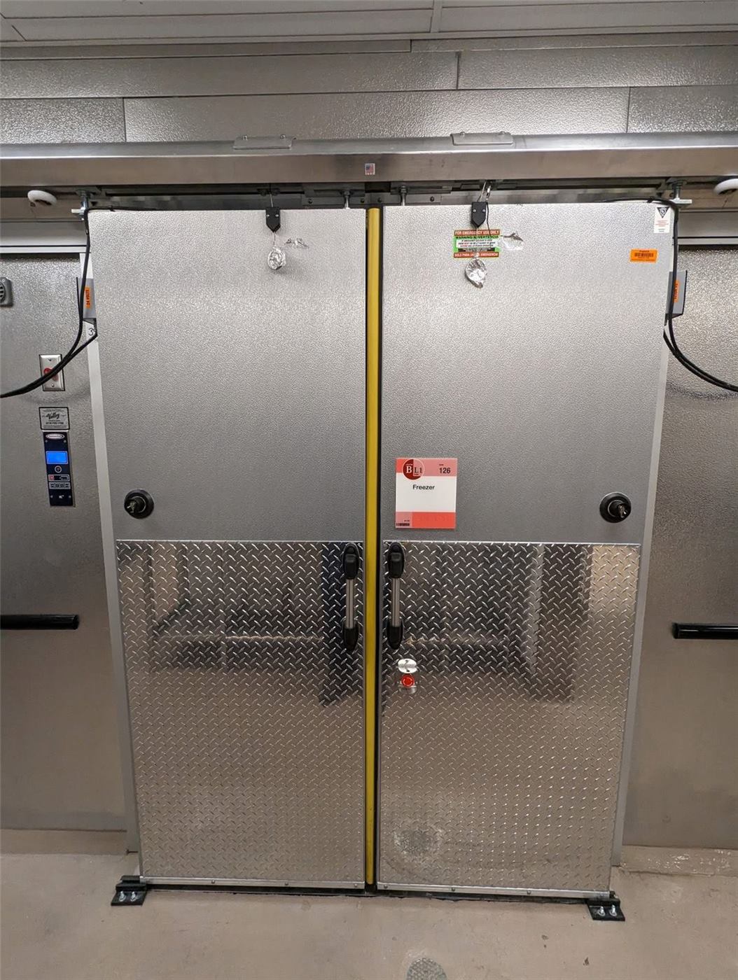 Stainless commercial refrigeration doors in a cold storage facility