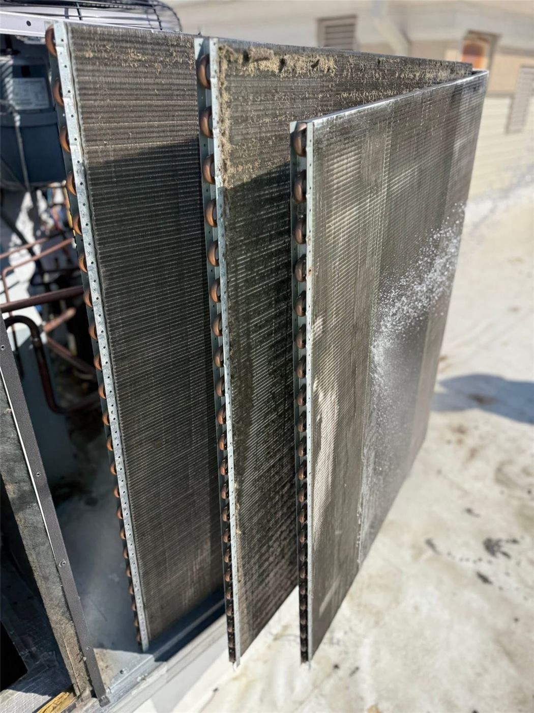Condenser coils removed and cleaned during a preventive maintenance visit